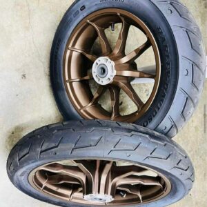 OEM Harley-Davidson Low Rider ST wheels with tires and brake rotors removed from a 2023 motorcycle with 61 miles