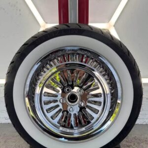 Genuine chrome wheel set from a 2009 Harley-Davidson Softail Deluxe featuring a mirror-like polished finish with premium ceramic coating for added protection and lasting shine.
